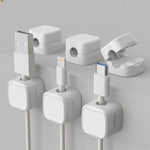 White magnetic cable clip shown open and closed with charging cables